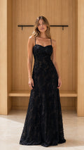 Front view of model wearing black lace maxi dress
