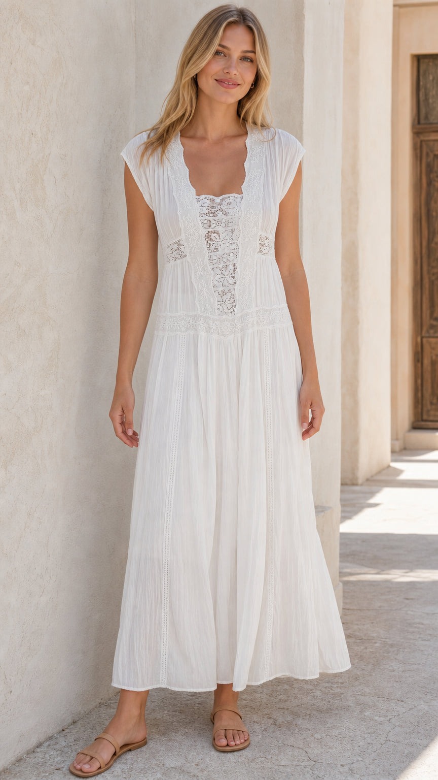 Front view of woman wearing white lace panel maxi dress