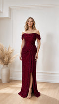Front view of burgundy off-the-shoulder evening gown with slit