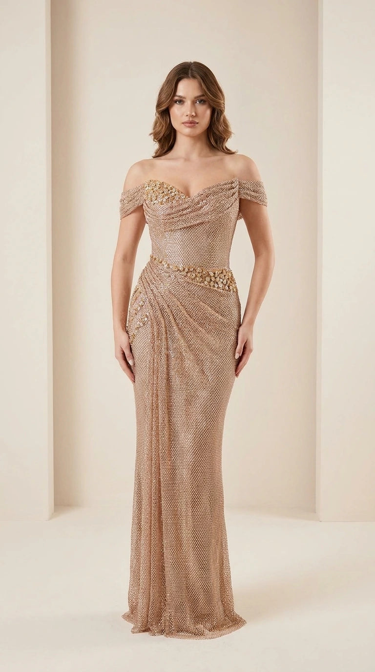 Front view of model wearing champagne off-shoulder beaded evening gown