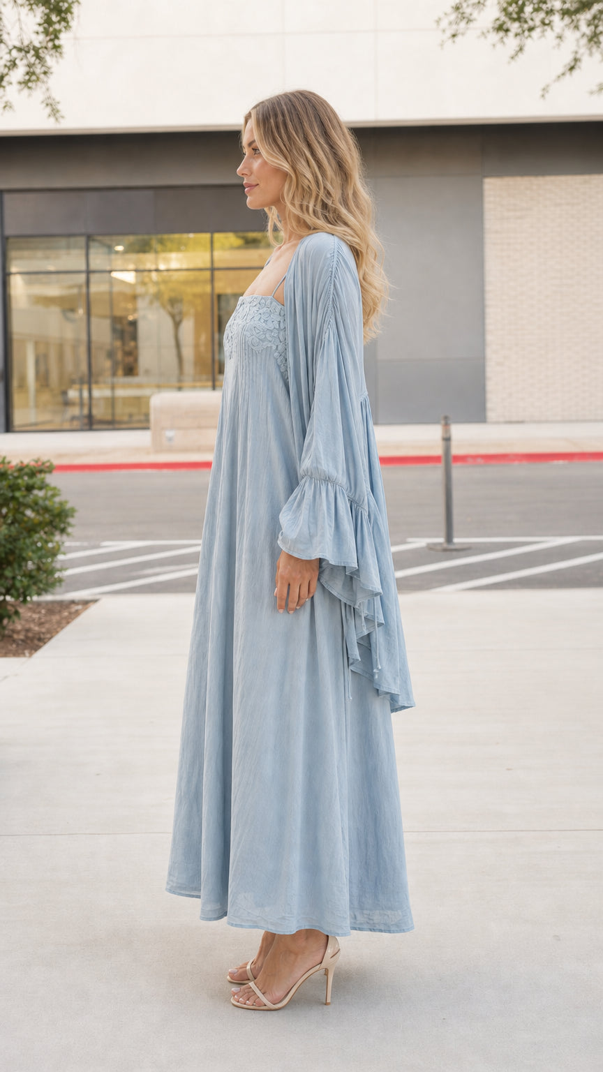 Model wearing light blue boho dress and kimono set, side view