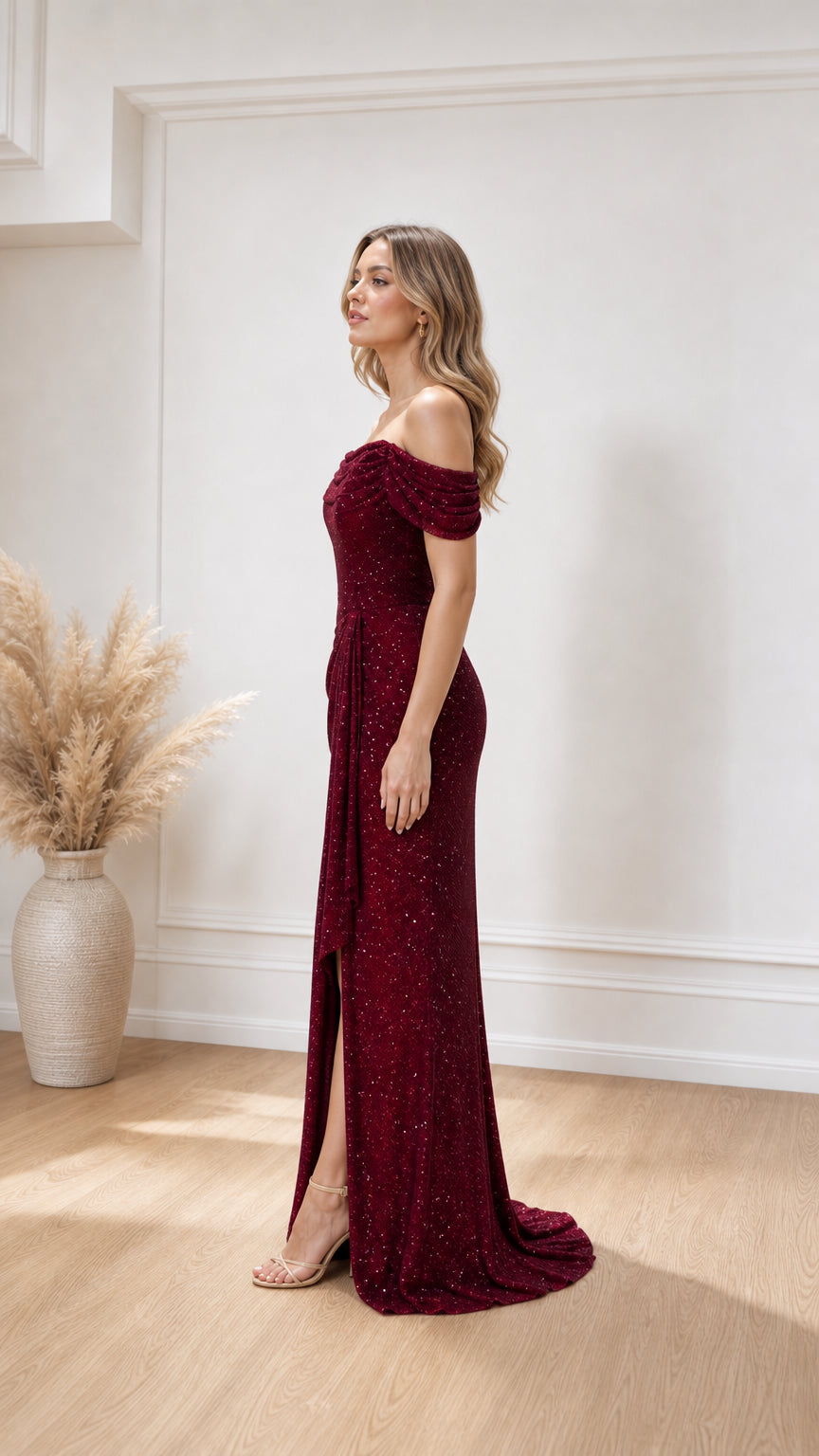 Side profile view of burgundy evening gown