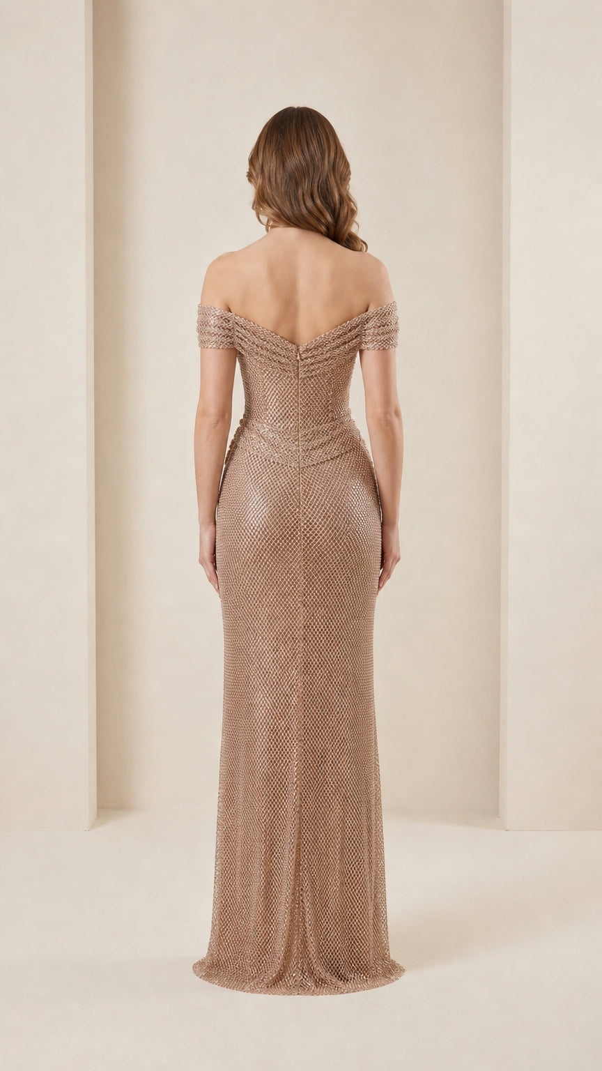 Back view of champagne evening gown showing fitted silhouette