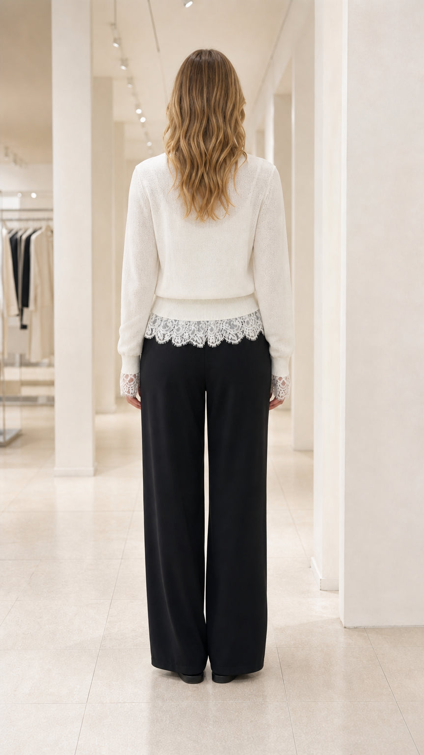 Back view of White knit cardigan showing clean drape and fit