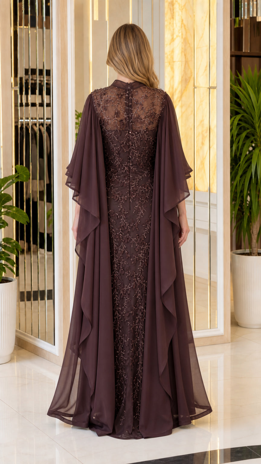 Back view showing flowing cape overlay