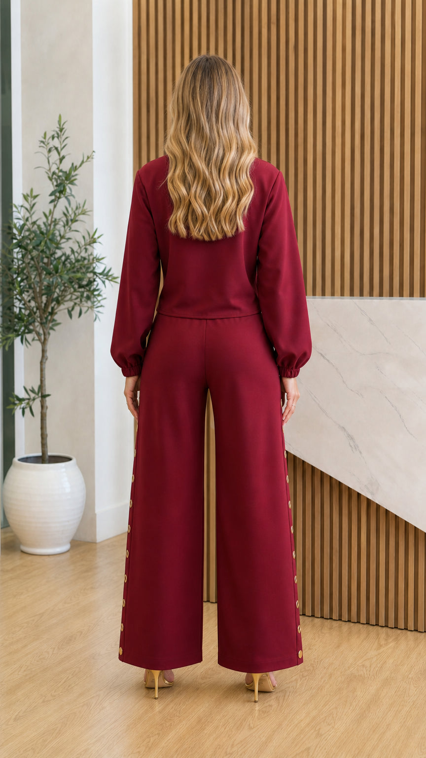 Back view of model in burgundy two-piece pants set