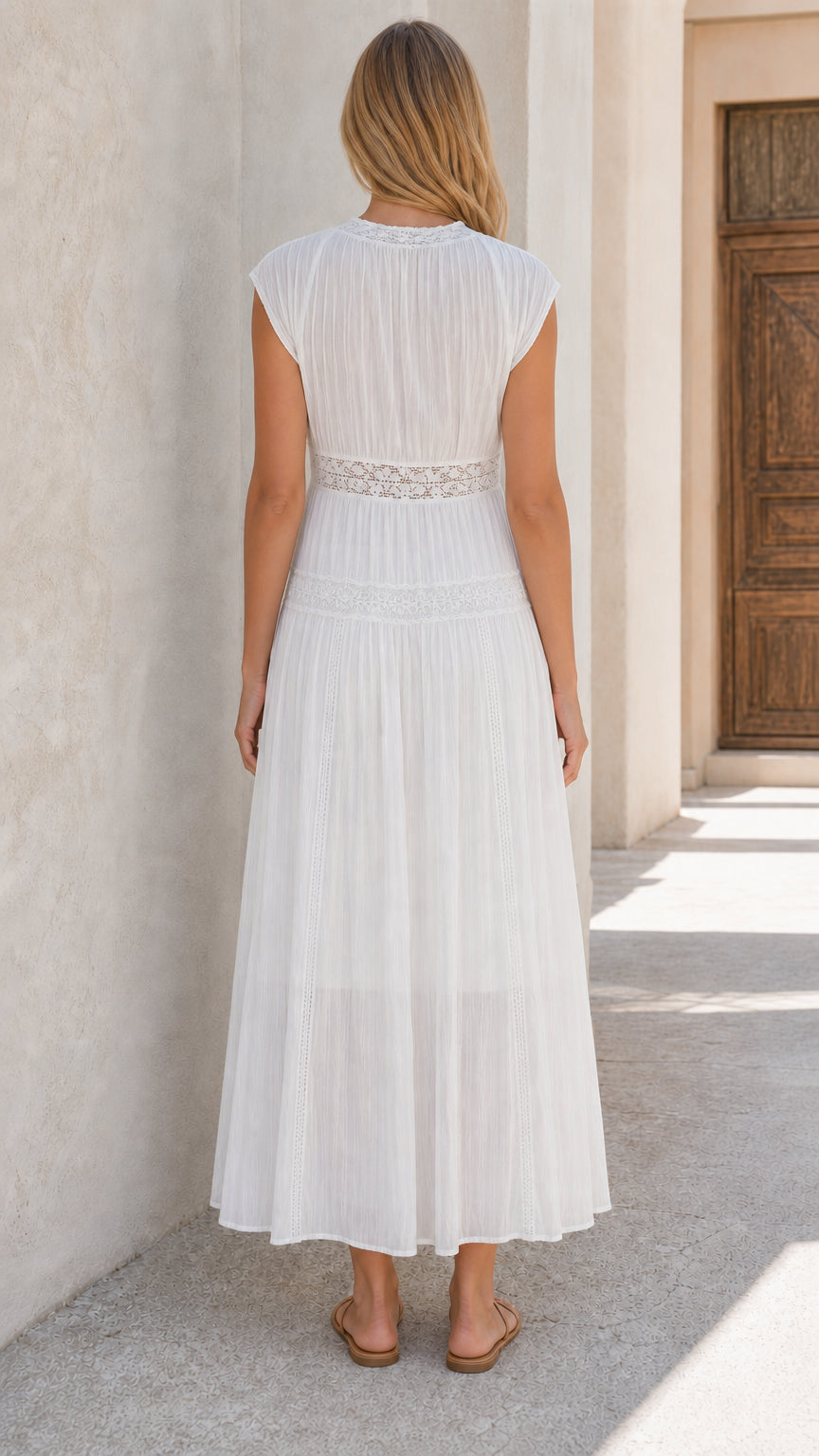 Back view of woman wearing white lace panel maxi dress