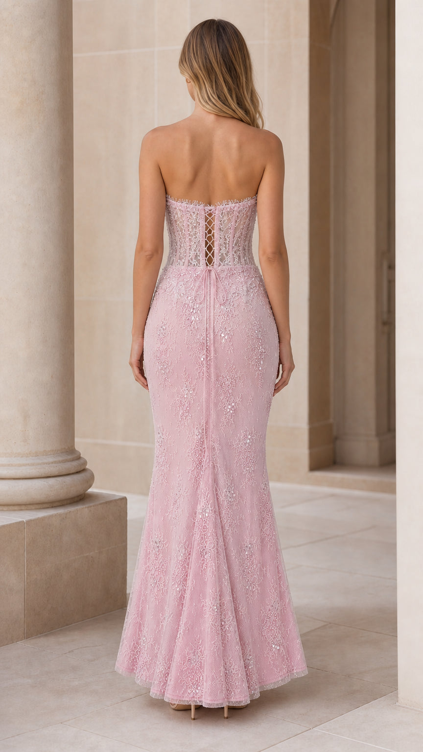 Back view showing lace-up detail of pink formal dress