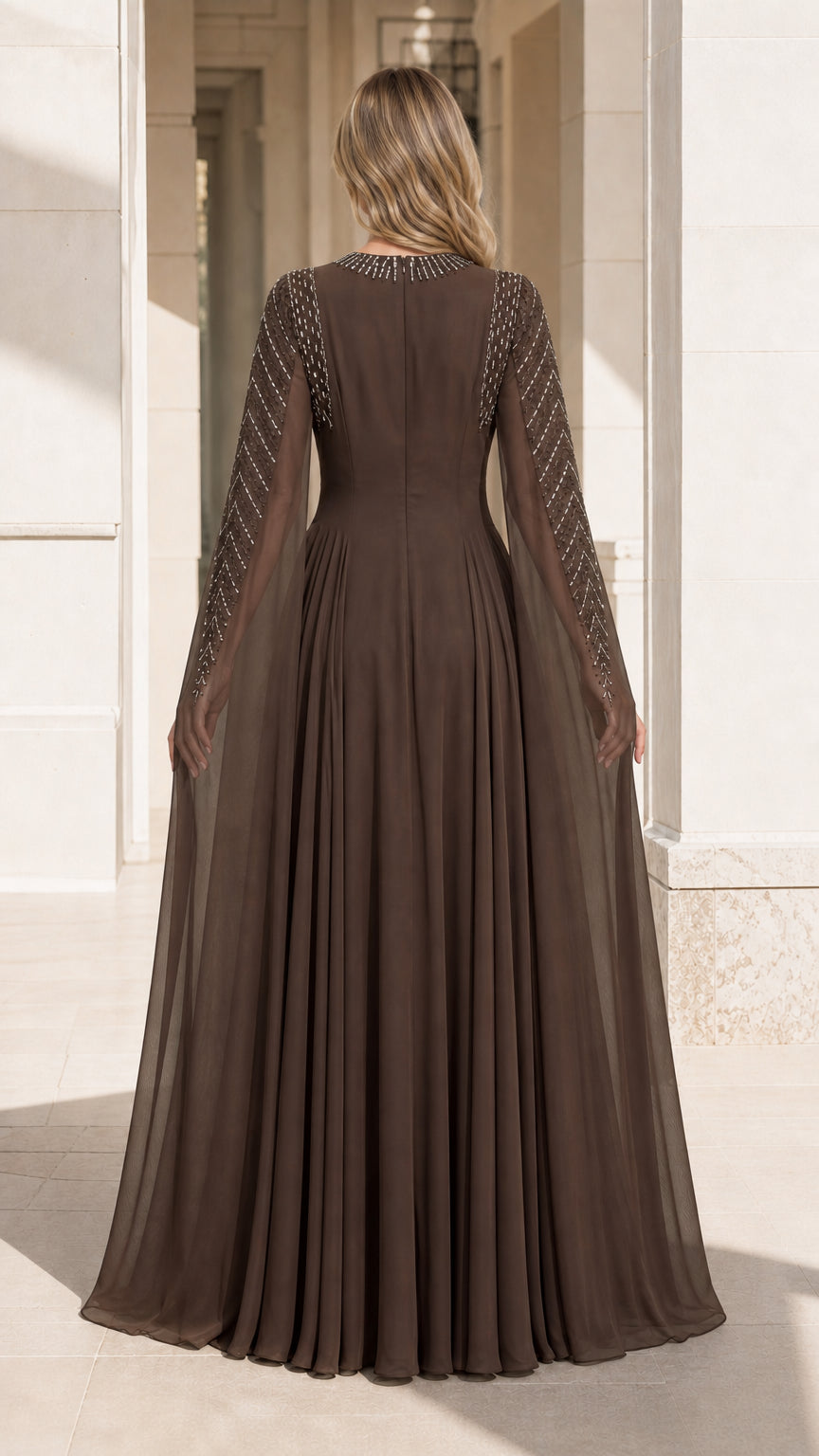 Back view of brown formal gown with caped sleeves