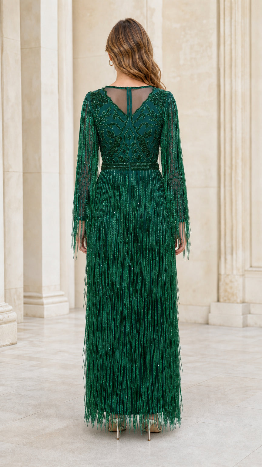 Back view showing sheer illusion paneling on emerald gown