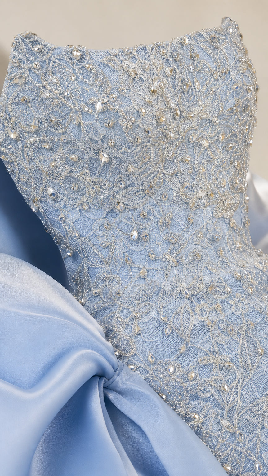 Close-up detail of bodice beadwork and lace texture