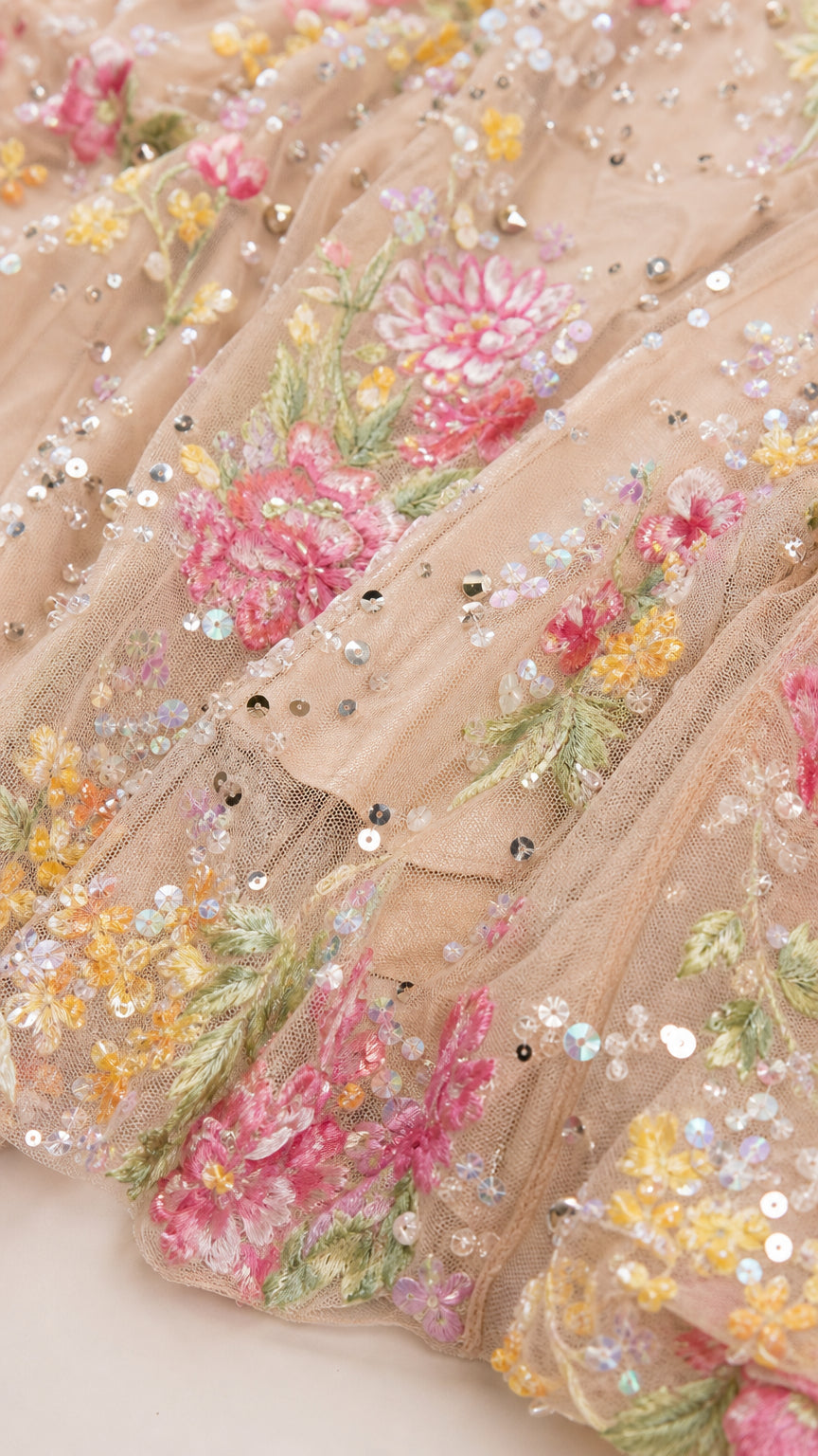 Close-up detail of floral embroidery and sequins