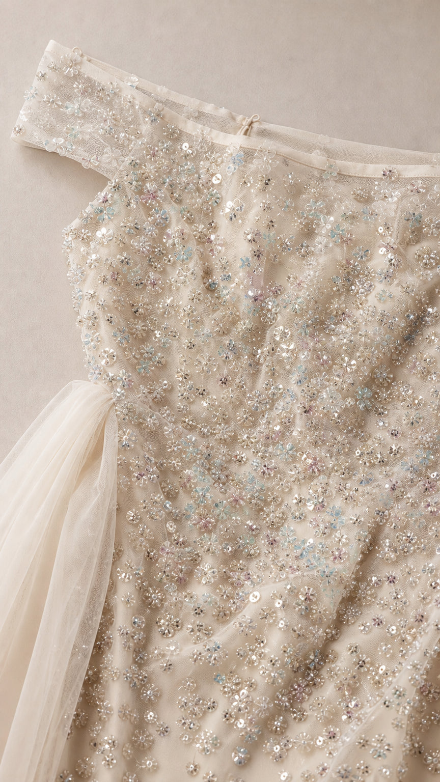 Close-up detail of sequin and bead embellishments on bodice