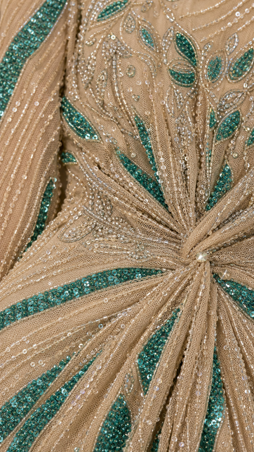 Close-up detail of sequin and bead embellishments on champagne dress