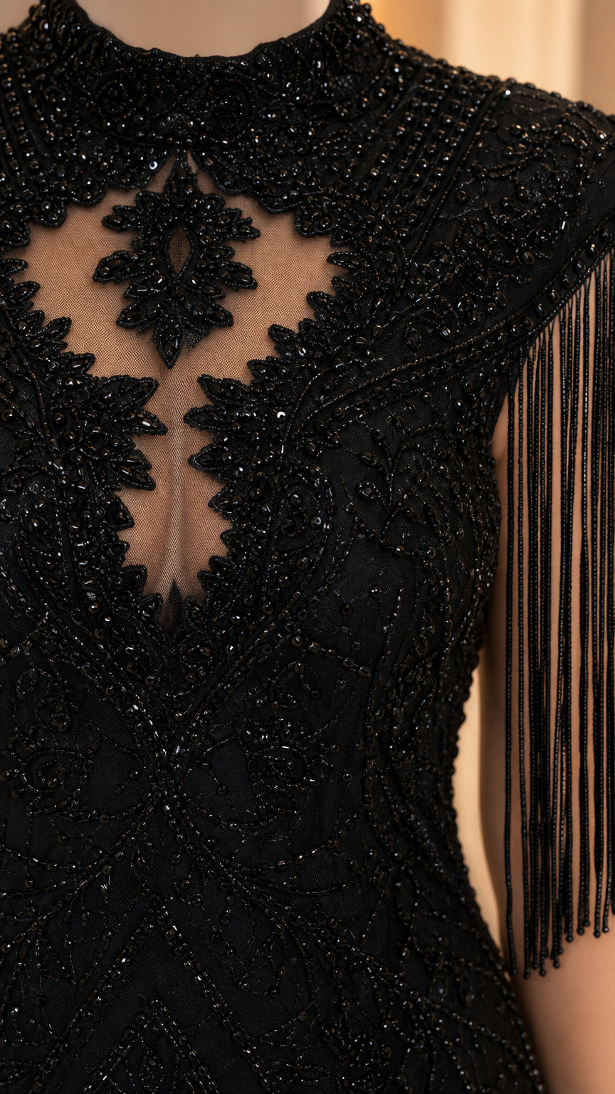 Close-up detail of mock neck, beadwork, and fringe