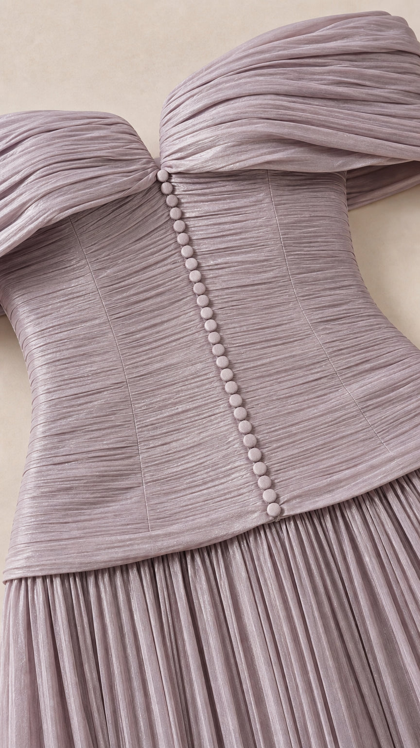 Close-up of ruched bodice and decorative buttons in lavender