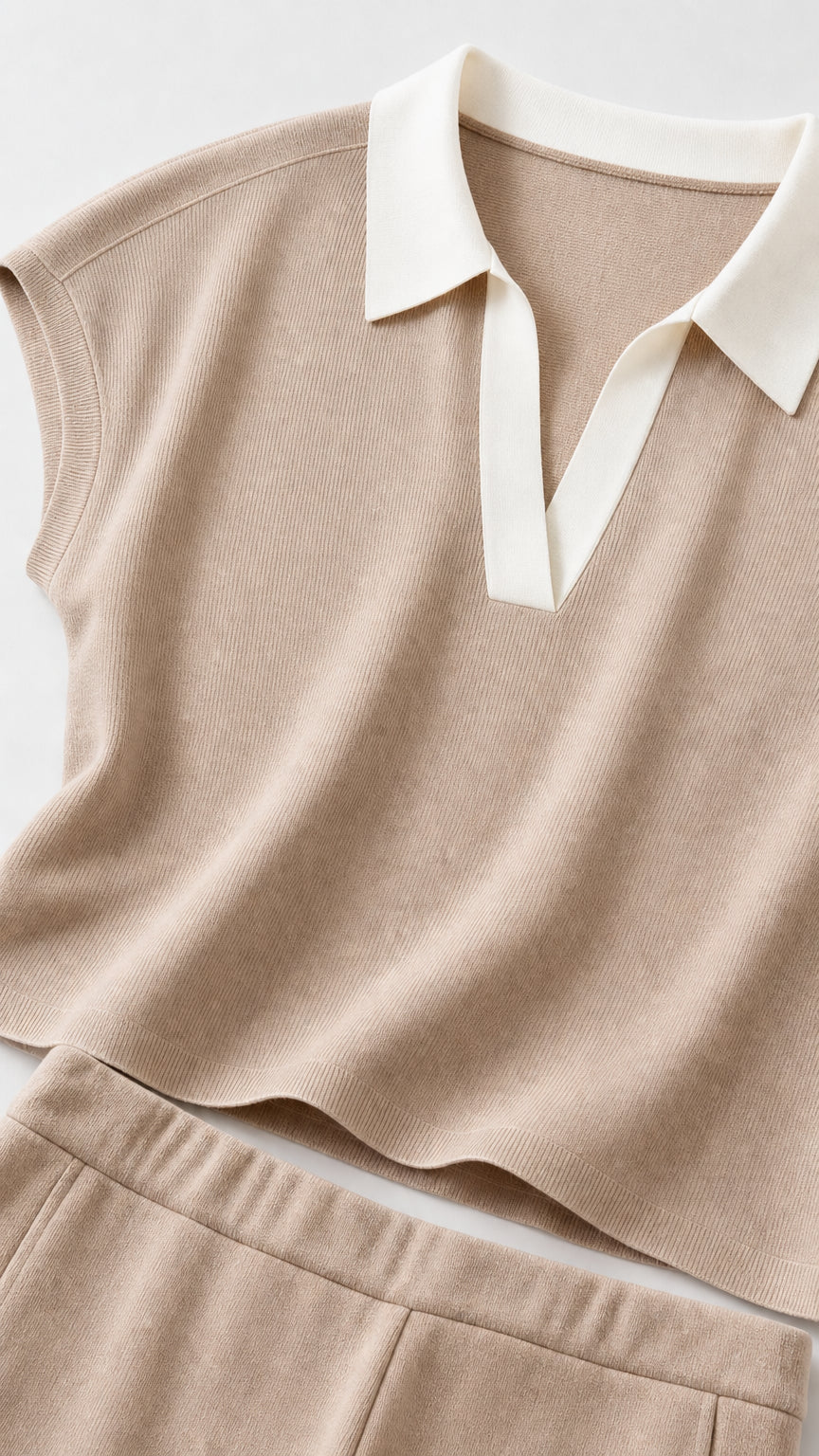 Close-up of beige knit polo collar and fabric texture