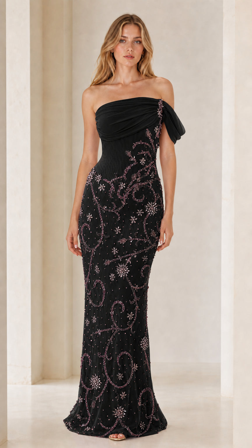 Front view of model wearing black one-shoulder beaded evening gown
