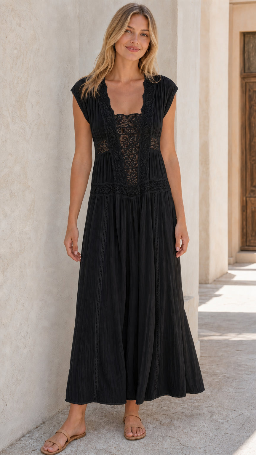 Woman wearing black sleeveless lace panel maxi dress
