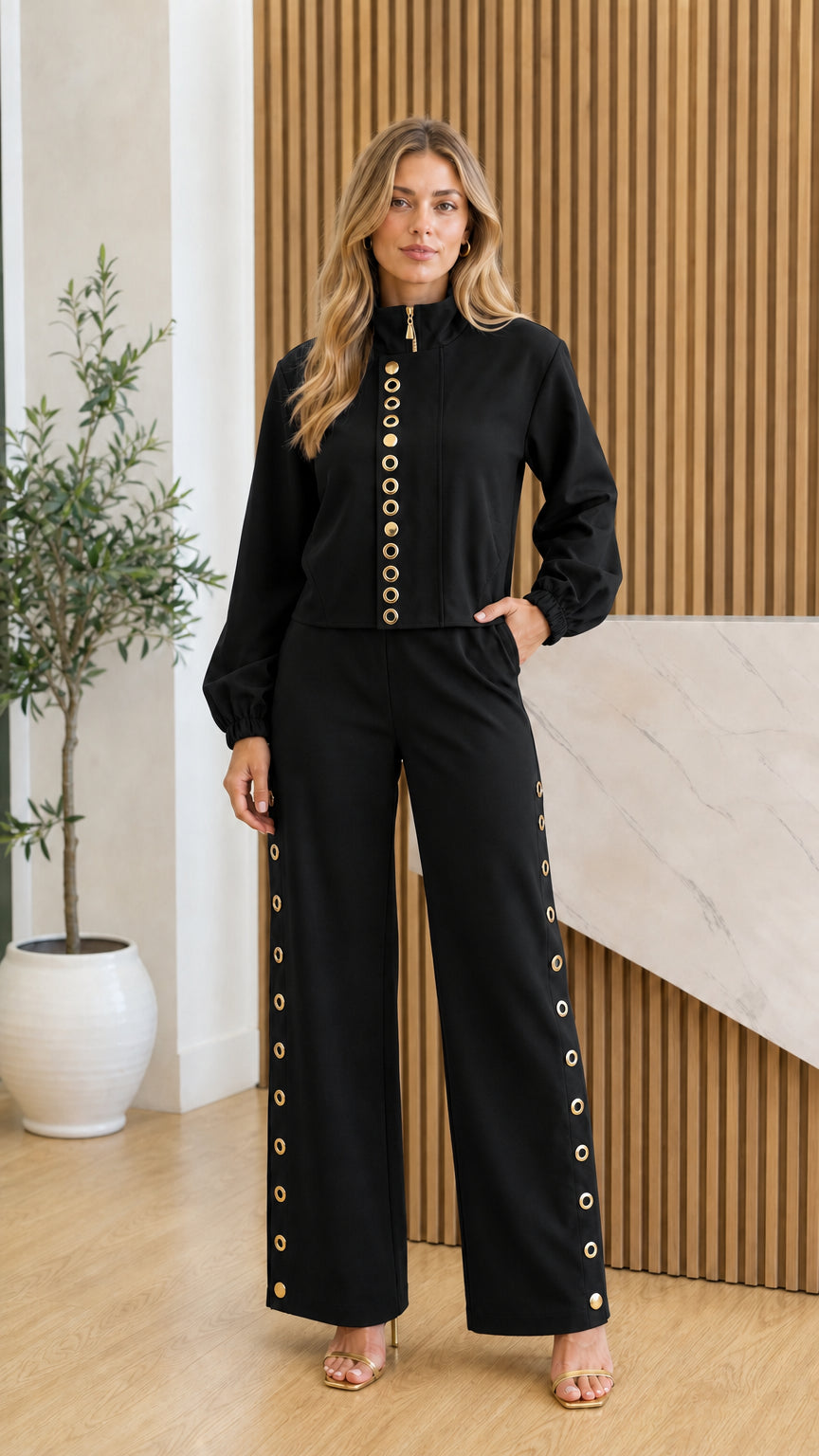Front view of model in black two-piece set with gold accents