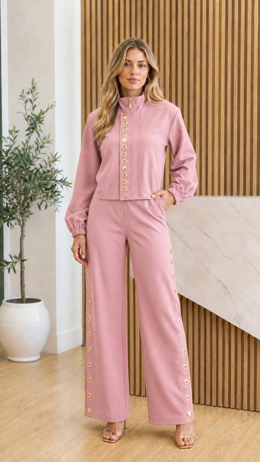 Front view of model in pink two-piece set with gold accents