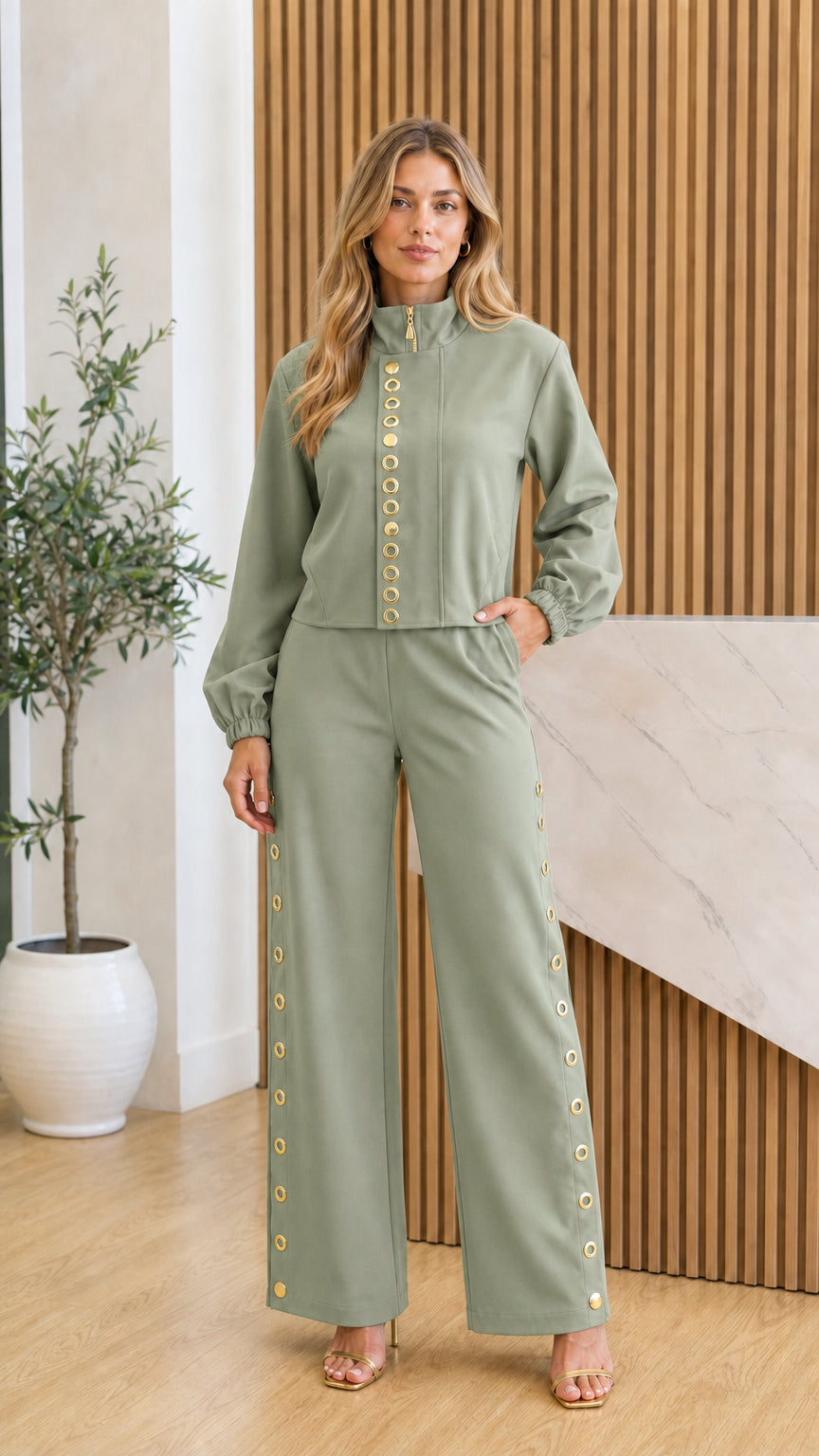 Front view of model in sage green two-piece set with gold accents