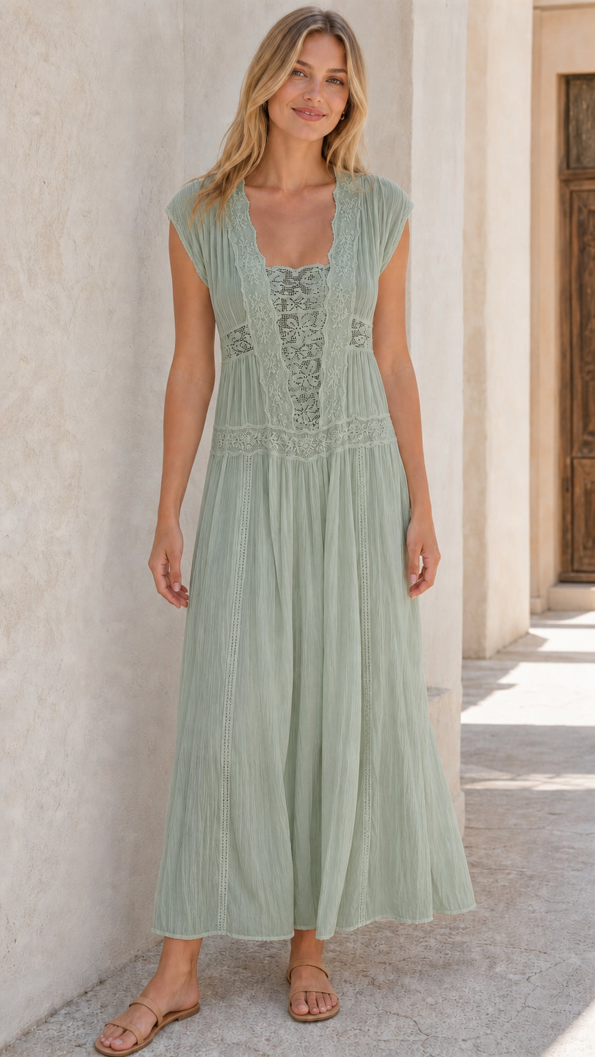 Woman wearing sage green sleeveless lace panel maxi dress