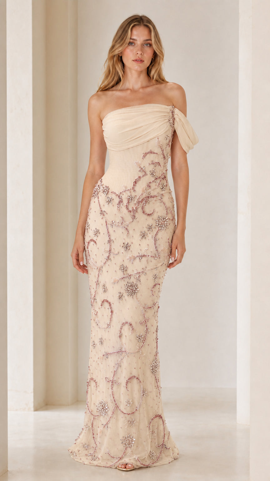 Front view of model wearing champagne one-shoulder beaded evening gown