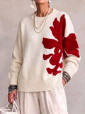 Oversized, Loose-fit, Casual Sweater With A Large, Color-block Floral Design.